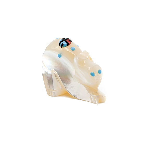 Mother of Pearl Bear with Turquoise eyes and accents, adorned with a Jet, Turquoise, and Red Coral Zuni Sun Face Bears are associated with healing, the white bear being the most powerful. White bear is also the directional guardian for the West  Measures approximately 1.25 inches long x .5 inches wide x 1.5 inches high