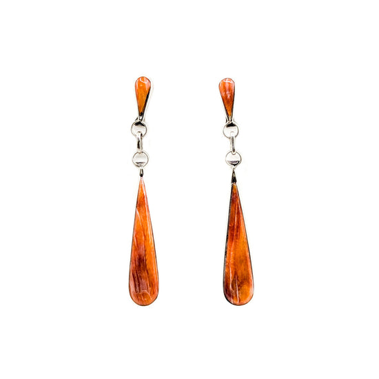 Handcrafted sterling silver and spiny oyster shell, long dangle earrings by Angela Gaspar.&nbsp;
Earring patterns and materials may vary slightly,&nbsp;please let us choose for you!
Each earring tapers from&nbsp; 1/8" wide to 1/4" wide from top to bottom and dangles from earlobe approximately 2"